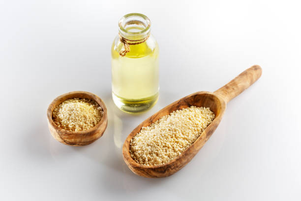 Sesame seed and oil, white background